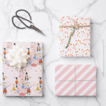 Nutcracker Pink Christmas Tree Holiday Wrapping Paper Sheet<br><div class="desc">This cute nutcracker holiday wrapping paper features a set of 3 different designs of wrapping papers. 1. A light pink background with a pink christmas tree decorated with nutcracker characters. 2. A white background with red and pink botanical patterns. 3. A white background with pink diagonal stripes. Change the background...</div>