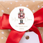 Nutcracker pink white simple Christmas Classic Round Sticker<br><div class="desc">White background,  and a pink nutcracker.  Personalize and add a name and year. Text: Merry Christmas</div>