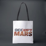 Occupy Mars Canvas Tote – Bold Statement for Futur<br><div class="desc">Make a fearless statement with this "Occupy Mars" canvas tote bag – a perfect blend of patriotism and vision. Designed for those who believe in a future beyond Earth, this bag symbolizes innovation, curiosity, and ambition. The American flag-inspired text adds a bold and stylish flair. Ideal for everyday use, this...</div>
