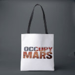 Occupy Mars Canvas Tote – Bold Statement for Futur<br><div class="desc">Make a fearless statement with this "Occupy Mars" canvas tote bag – a perfect blend of patriotism and vision. Designed for those who believe in a future beyond Earth, this bag symbolizes innovation, curiosity, and ambition. The American flag-inspired text adds a bold and stylish flair. Ideal for everyday use, this...</div>