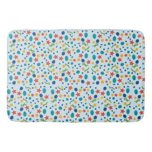 Ocean beach with starfish, shells and pebbles bath mat