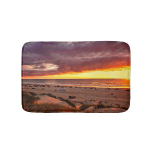 Ocean sunset with spectators on the beach bath mat