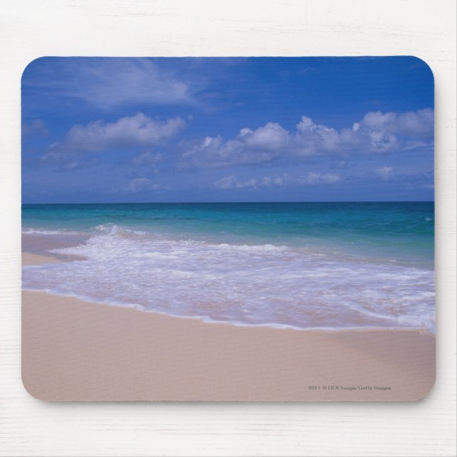 Ocean waves foaming onto sandy beach mouse pad (Front)