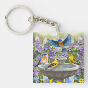 Oiseaux colorés et jardin de fleurs de bain d'oise