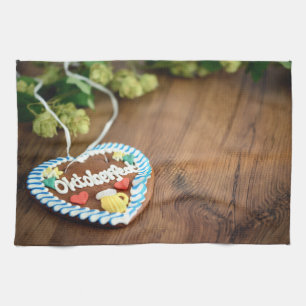 Oktoberfest gingerbread heart with hop on table kitchen towel