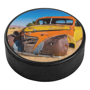 Old and abandoned car in Solitaire, Namibia Hockey Puck