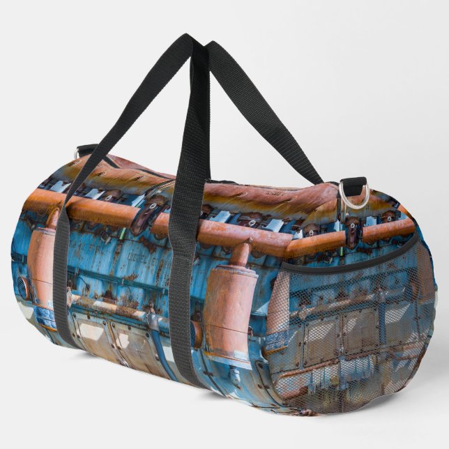 Old and rusty Atlas Imperial diesel engine at Inde Duffle Bag (Right Corner)