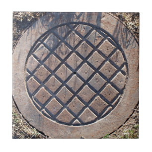 Old and rusty manhole tile