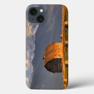 Old barn framed by hay bales and dramatic iPhone 13 case