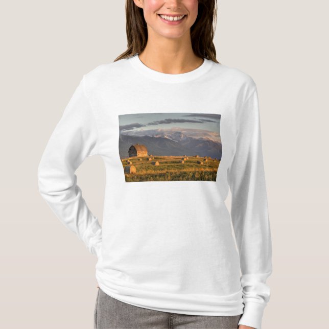 Old barn framed by hay bales and dramatic T-Shirt (Front)