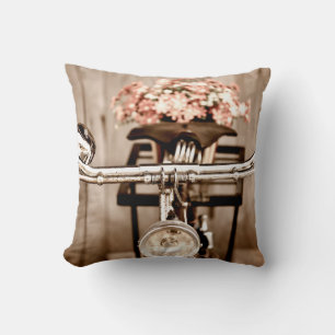 Old bicycle and flowers blur in background process throw pillow