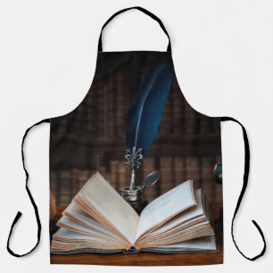 Old books, quill pen and vintage inkwell on wooden apron