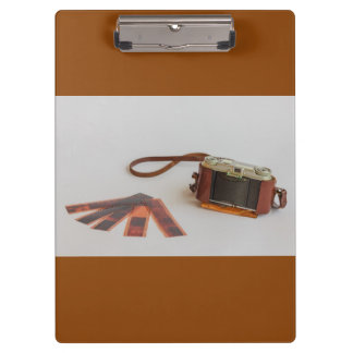 old camera with negative on   clipboard