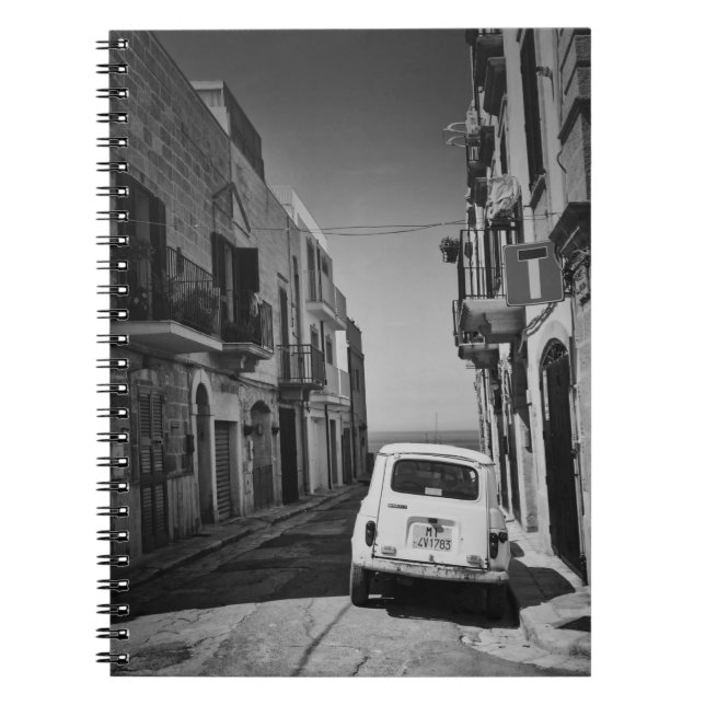 Old car in a street in Italy with sea Notebook (Front)