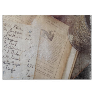 Old cookbook and recipes cutting board