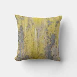Old grey concrete wall with peeling yellow paint. throw pillow