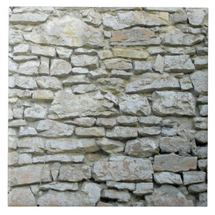 Old grey stone wall tile