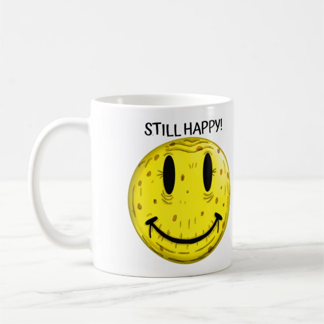 OLD HAPPY FACE. OLD BUT STILL HAPPY COFFEE MUG (Left)