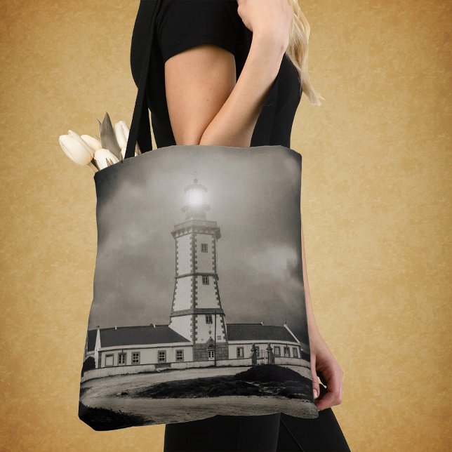 Old lighthouse on a storm night tote bag (Old lighthouse on a storm night. tote bag)