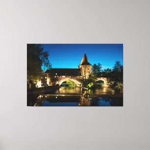 Old medieval bridge at night in Nuremberg Canvas Print