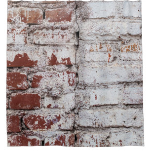 Old painted brick wall with peeling white paintwal