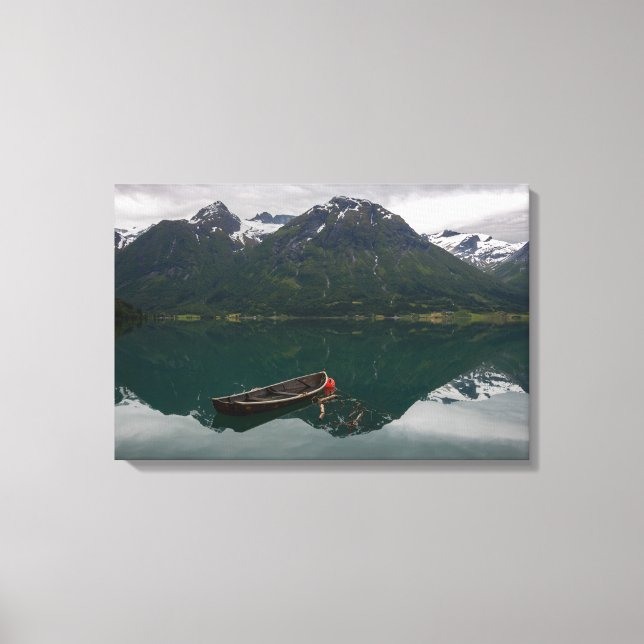 Old rowboat with mountain reflection canvas print (Front)