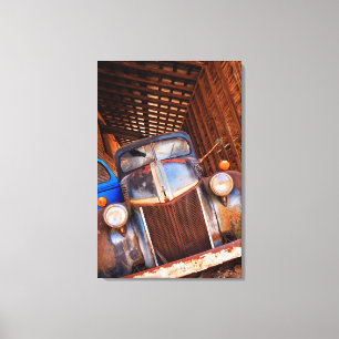 Old rusty truck on a farm canvas print