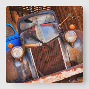 Old rusty truck on a farm square wall clock