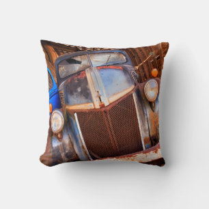 Old rusty truck on a farm throw pillow