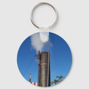 old steam whistle with a white plume of steam keychain