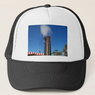 old steam whistle with a white plume of steam trucker hat