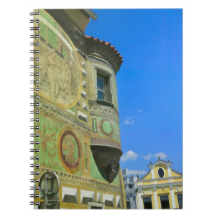 Old town square surrounded by 16th-century notebook