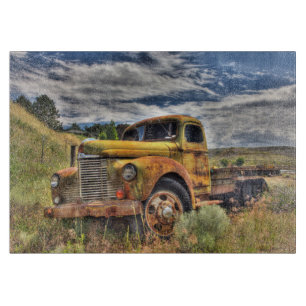 Old truck abandoned in field cutting board