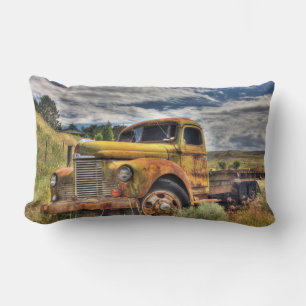 Old truck abandoned in field lumbar pillow
