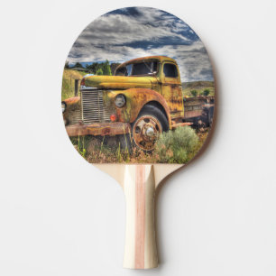 Old truck abandoned in field ping pong paddle