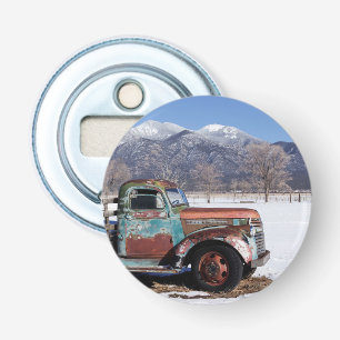 Old truck sitting in the field bottle opener