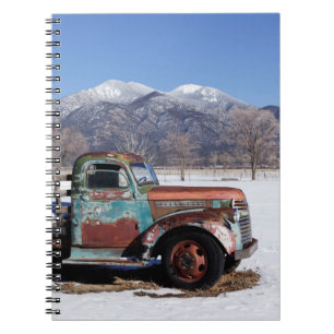 Old truck sitting in the field notebook