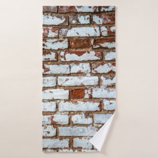 Old vintage brick wall with sprinkled white plaste bath towel