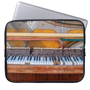 Old vintage piano with the lid off. A dilapidated Laptop Sleeve