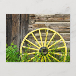 Old wagon wheel in historic old gold town postcard