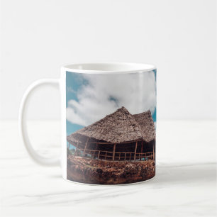 Old wooden tropical bungalow on the beachancient,a coffee mug