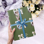 Olive green cream bow photo script Christmas Wrapping Paper<br><div class="desc">A muted olive green background,  cream coloured text and a bow. Text and photo.  Merry Christmas is written with an elegant hand-lettered style font. 
Personalize and add your family name.</div>