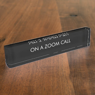 On a zoom call black custom text elegant nameplate