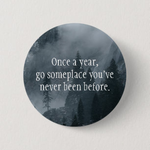 Once a year, go somewhere you've never been before 2 inch round button