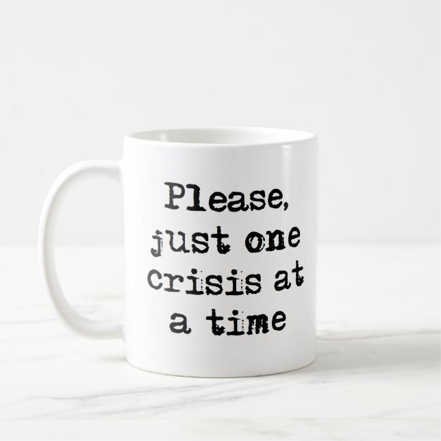 one crisis at a time coffee mug (Left)
