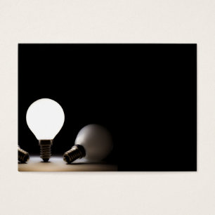 One light bulb shining in a dark space