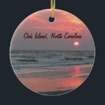 One Perfect Sunset - Oak Island, NC Ceramic Ornament<br><div class="desc">This is a photo of a really beautiful sunset at Oak Island, North Carolina. The sun's light is filtered by some later afternoon clouds, causing it to look like a hot ball of wax as it prepares to sink into the ocean. Brilliant pink and orange are reflected by the wet...</div>