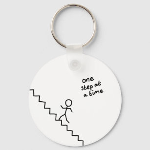 "one step at a time" stick man on stairs keychain