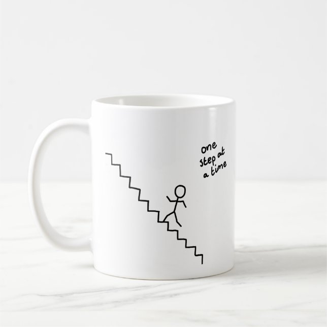 "one step at a time" stick man on the stairs mug (Left)
