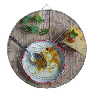 Onion pineapple chutney on rustic wood dartboard